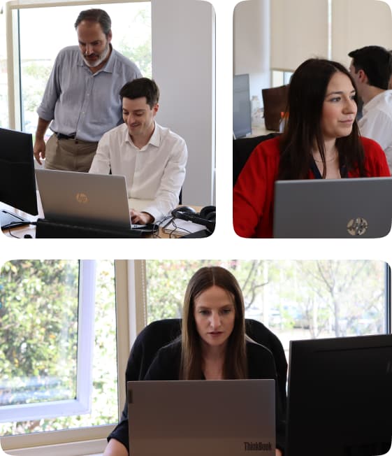 Equipo de Soluciona Mi Deuda trabajando en la oficina